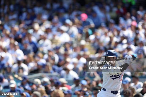 Los Angeles Dodgers designated hitter Shohei Ohtani warms up prior to batting during the fifth inning of a game against the St. Louis Cardinals at...