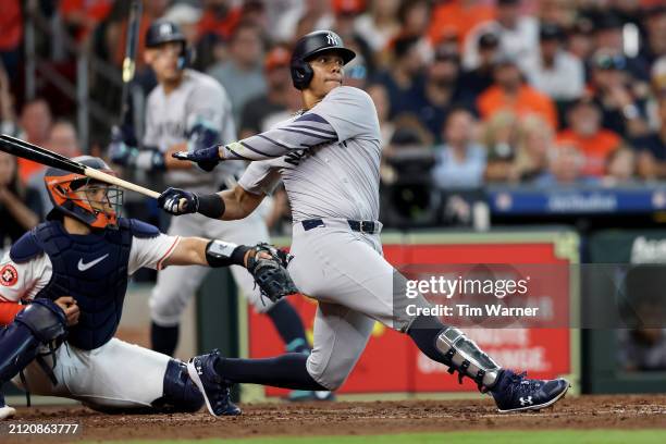 Juan Soto of the New York Yankees hits an RBI single in the fifth inning against the Houston Astros on Opening Day at Minute Maid Park on March 28,...