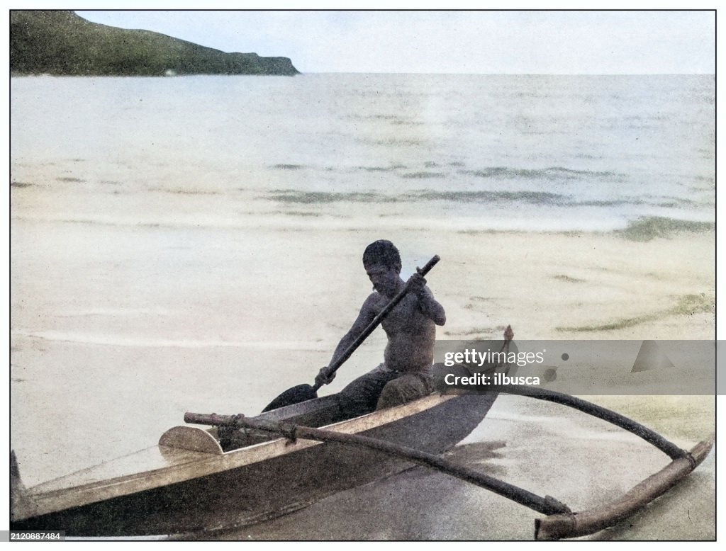 Antique black and white photograph: Canoeman near Diamond Head, Hawaii