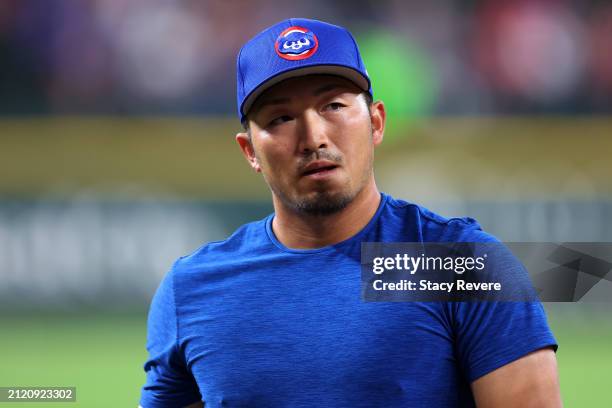 Seiya Suzuki of the Chicago Cubs participates in warmups prior to the Opening Day game against the Texas Rangers at Globe Life Field on March 28,...