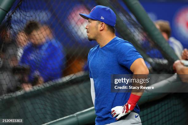 Seiya Suzuki of the Chicago Cubs participates in warmups prior to the Opening Day game against the Texas Rangers at Globe Life Field on March 28,...