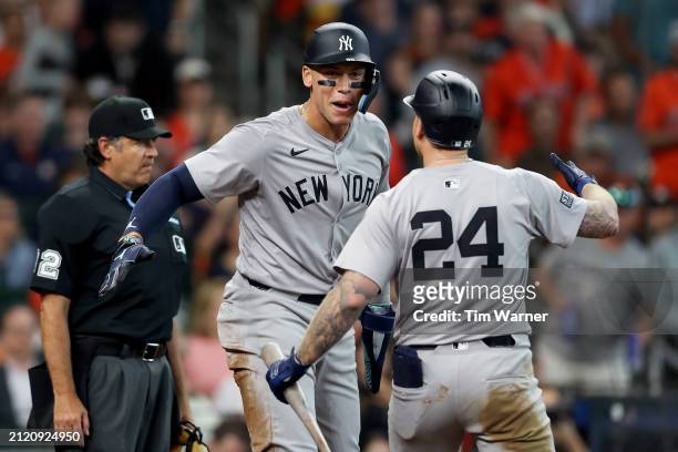 Aaron Judge of the New York Yankees celebrates scoring on a sacrifice fly off the bat of Alex Verdugo in the seventh inning against the Houston...