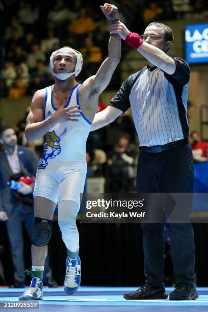 Josiah Fry of the Johnson & Wales University Wildcats wins at 125 lbs. Against Christian Guzman of the North Central College Cardinals during the...