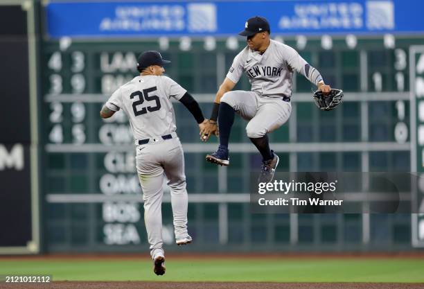 Gleyber Torres and Juan Soto of the New York Yankees celebrate a 5-4 win over the Houston Astros on Opening Day at Minute Maid Park on March 28, 2024...