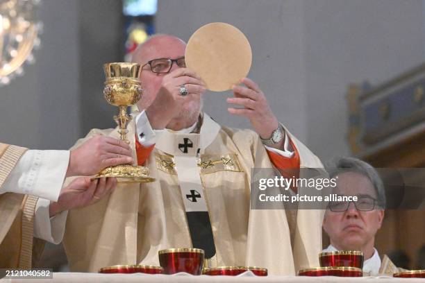 March 2024, Bavaria, Munich: Cardinal Reinhard Marx celebrates mass during a Catholic service in the cathedral in the state capital on Easter Sunday,...