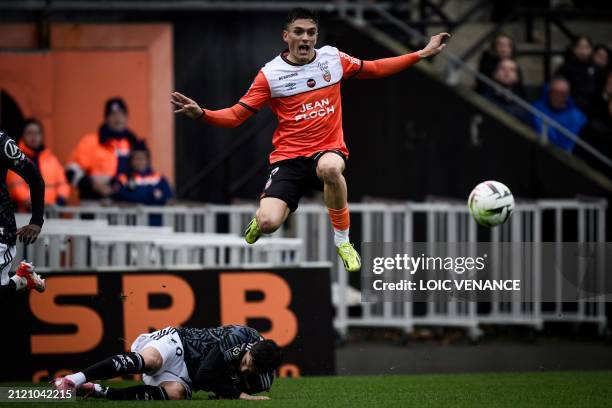 Brest's French midfielder Jonas Martin fights for the ball with Lorient's Greek midfielder Panos Katseris during the French L1 football match between...