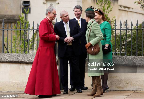 Prince Andrew, Duke of York and Sarah Ferguson speak with Princess Anne as they leave after attending the Easter Matins Service at St. George's...