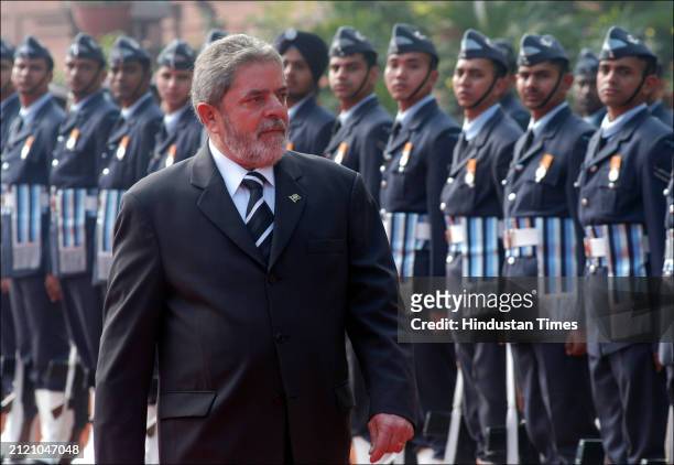 Brazilian President Luiz Inácio Lula da Silva inspects the guard of honor during his ceremonial reception at the Presidential Palace, on January 25,...