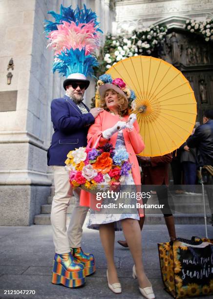 People pose as they participate in the Easter parade outside Saint Patrick's Cathedral on March 31, 2024 in New York City. Every year people gather...