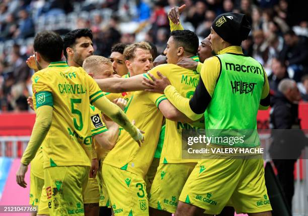 Nantes' Egyptian forward Mostafa Mohamed celebrates with teammates after scoring his team's second goal after scoring during the French L1 football...