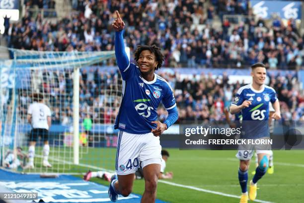 Strasbourg's French forward Jeremy Sebas celebrates after scoring his team's second goal during the French L1 football match between RC Strasbourg...