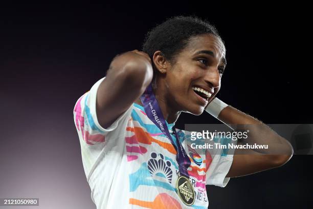 Naomi Girma of San Diego Wave FC reacts with their winner medal after defeating NJ/NY Gotham FC to win the NWSL Challenge Cup at Red Bull Arena on...