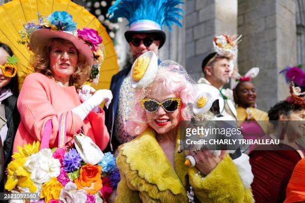People attend the annual Easter Parade and Bonnet Festival on Fifth Avenue in front of St. Patrick's Cathedral in New York on March 31, 2024.