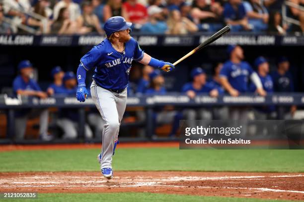 Justin Turner of the Toronto Blue Jays hits a home run during the fifth inning against the Tampa Bay Rays at Tropicana Field on March 31, 2024 in St...