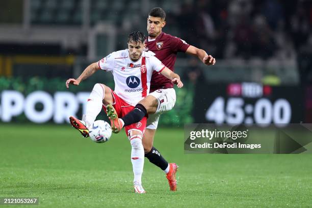 Dany Mota of Ac Monza and Adam Masina of Torino Fc battle for the ball during the Serie A TIM match between Torino FC and AC Monza at Stadio Olimpico...