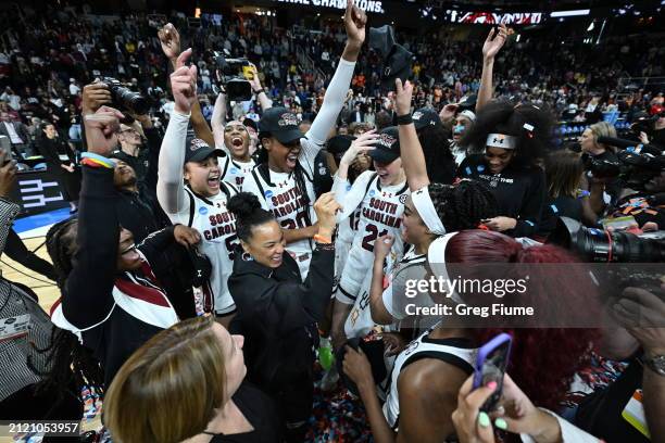 The South Carolina Gamecocks celebrate after defeating the Oregon State Beavers during the Elite Eight round of the 2024 NCAA Women's Basketball...