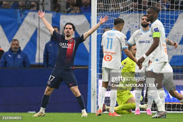 Paris Saint-Germain's Portuguese midfielder Vitinha celebrates after scoring the opening goal during the French L1 football match between Olympique...