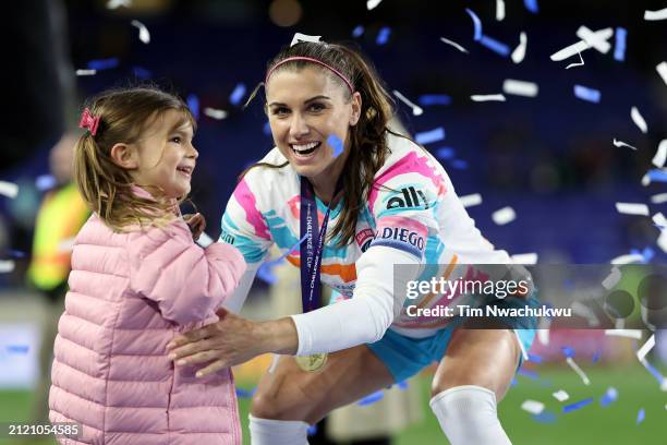 Alex Morgan of San Diego Wave FC looks on with their daughter, Charlie Carrasco, after defeating NJ/NY Gotham FC to win the NWSL Challenge Cup at Red...