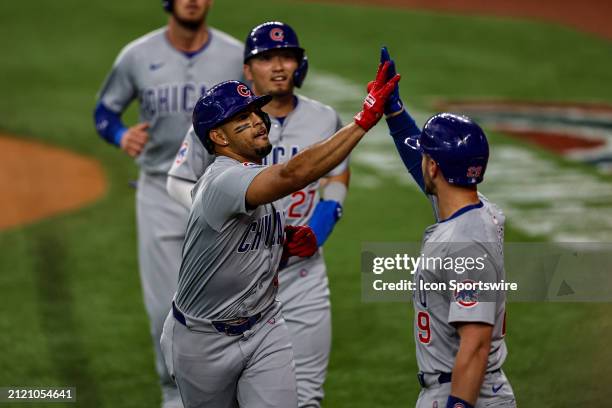 Chicago Cubs second baseman Christopher Morel gets high fives after hitting a 3 run homer after hitting a home run during the game between the Texas...