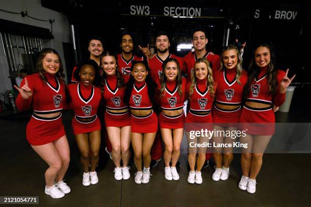 The NC State Wolfpack cheerleading team poses for a photo ahead of the game against the Duke Blue Devils in the Elite 8 round of the NCAA Men's...