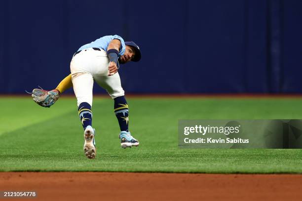 Jose Caballero of the Tampa Bay Rays reacts after throwing to first base during the eighth inning against the Toronto Blue Jays at Tropicana Field on...