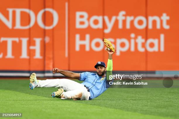 Amed Rosario of the Tampa Bay Rays reacts after a diving catch during the eighth inning against the Toronto Blue Jays at Tropicana Field on March 31,...