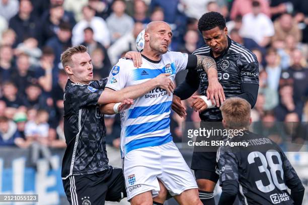 Tolis Vellios of PEC Zwolle heads the ball with Silvano Vos of AFC Ajax during the Dutch Eredivisie match between PEC Zwolle and AFC Ajax at MAC³PARK...