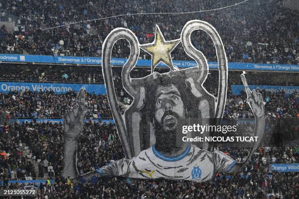 Tifo depicting French-Algerian comedian Redouane Bougheraba and the Champions League trophy is displayed by Marseille supporters prior to the French...