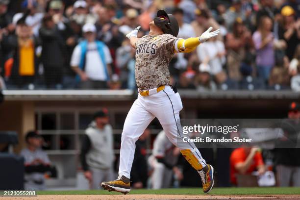Ha-Seong Kim of the San Diego Padres celebrates a three-run home run in the second inning during a game against the San Francisco Giants at PETCO...