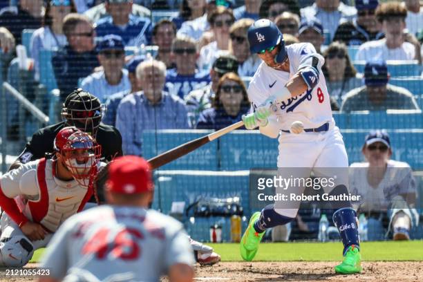 Los Angeles, CA, Thursday, March 28, 2024 - Enrique Hernandez swings at a pitch during a game against the St. Louis Cardinals at Dodger Stadium.
