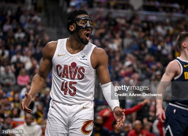 Donovan Mitchell of the Cleveland Cavaliers is shocked after being locked up by Christian Braun of the Denver Nuggets and losing possession of the...