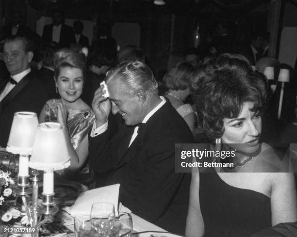 Princess Grace Of Monaco, Vittorio De Sica, and Maria Callas are seen here at the table of honor in Monte Carlo's sporting club during the gala...