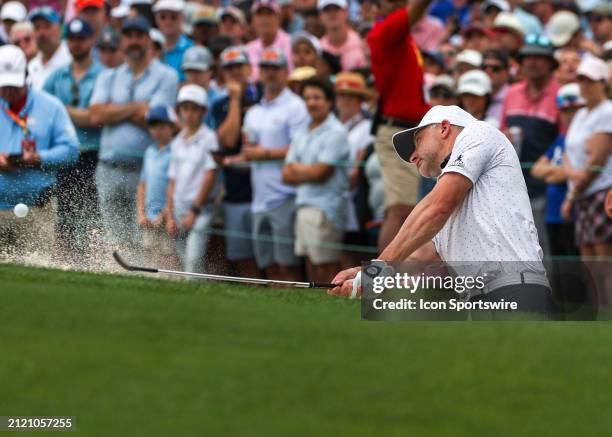David Skinns chips a shot out of the bunker on 18 green during the final round of the PGA Texas Children's Houston Open at Memorial Park Golf Course...