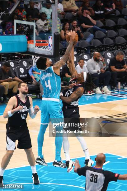 Nick Richards of the Charlotte Hornets blocks the shot by Terance Mann of the LA Clippers during the game on March 31, 2024 at Spectrum Center in...