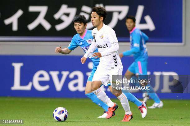 Teppei Usui of V-Varen Nagasaki controls the ball against Hideto Takahashi of Sagan Tosu during the J.League YBC Levain Cup Group D match between...