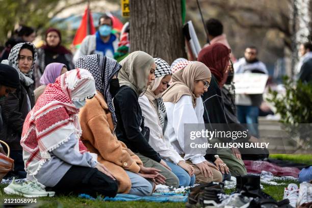 Muslim women pray during a demonstration on Palestine Land Day, one of hundreds of protests worldwide, Washington, DC, March 30, 2024. Land Day...