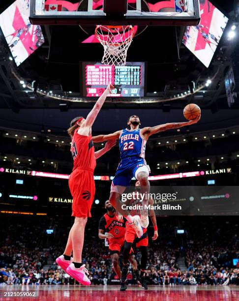 Cameron Payne of the Philadelphia 76ers goes to the basket against Kelly Olynyk of the Toronto Raptors during the second half of their basketball...