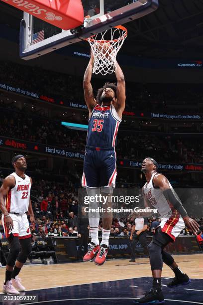 Marvin Bagley III of the Washington Wizards dunks the ball during the game against the Miami Heat on March 31, 2024 at Capital One Arena in...
