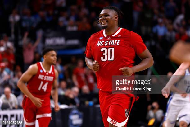 Burns Jr. #30 of the NC State Wolfpack reacts following a basket during the second half against the Duke Blue Devils in the Elite 8 round of the NCAA...