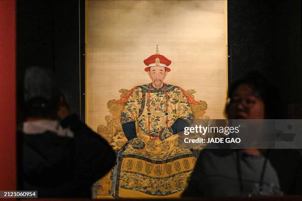 Replica of Kangxi Emperor in court robes is seen during a media preview of "The Forbidden City and the Palace of Versailles" exhibition, which...