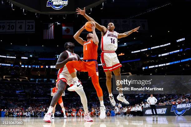 Keshad Johnson of the Arizona Wildcats attempts to block a shot against Chase Hunter of the Clemson Tigers during the first half in the Sweet 16...