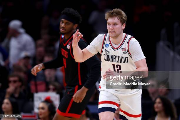 Cam Spencer of the Connecticut Huskies celebrates a three point basket against the San Diego State Aztecs during the first half in the Sweet 16 round...