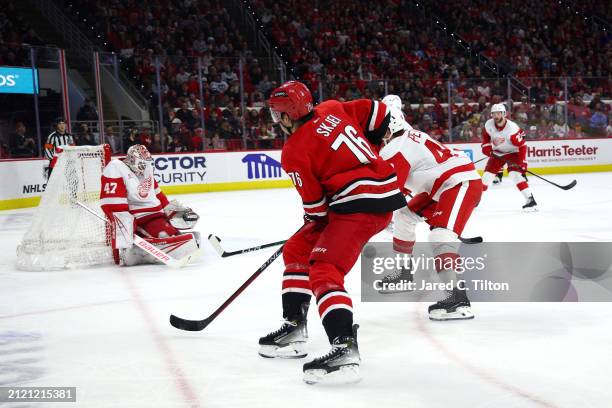 Brady Skjei of the Carolina Hurricanes scores a goal during the second period of the game against the Detroit Red Wings at PNC Arena on March 28,...