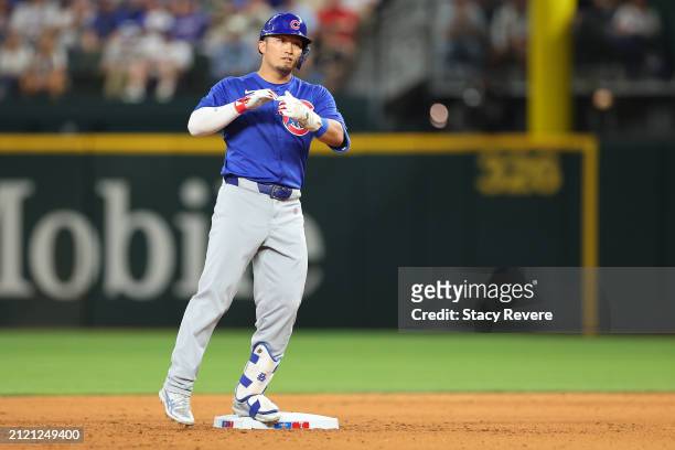 Seiya Suzuki of the Chicago Cubs reacts to a double during the sixth inning of the Opening Day game against the Texas Rangers at Globe Life Field on...