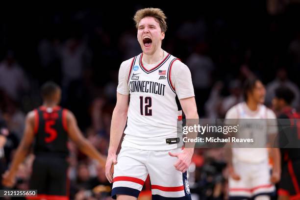 Cam Spencer of the Connecticut Huskies celebrates against the San Diego State Aztecs during the second half in the Sweet 16 round of the NCAA Men's...