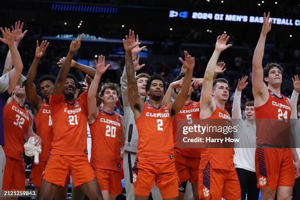 The Clemson Tigers celebrate after defeating the Arizona Wildcats during the second half in the Sweet 16 round of the NCAA Men's Basketball...