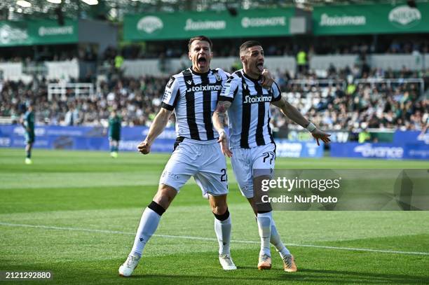 Kiril Despodov, wearing number 77, and Stefan Schwab, number 22, of PAOK FC are celebrating a goal during the Greek Super League Play Off match...