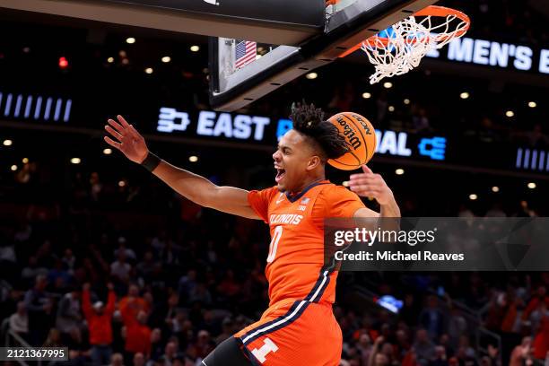 Terrence Shannon Jr. #0 of the Illinois Fighting Illini celebrates after dunking the ball against the Iowa State Cyclones during the first half in...