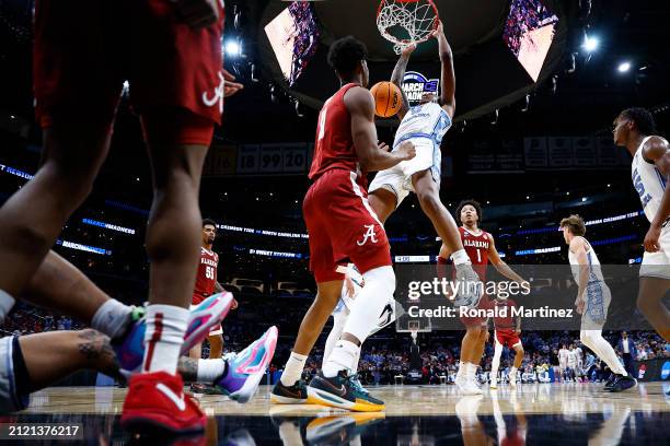 Armando Bacot of the North Carolina Tar Heels dunks against the Alabama Crimson Tide during the first half in the Sweet 16 round of the NCAA Men's...