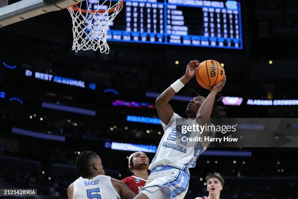 Jae'Lyn Withers of the North Carolina Tar Heels shoots against Jarin Stevenson of the Alabama Crimson Tide during the second half in the Sweet 16...